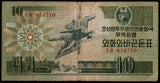 North Korea 10 Won Capitalist Visitor - 1988 P#29a.1 Fine Bank Note N#211440 #UCN510
